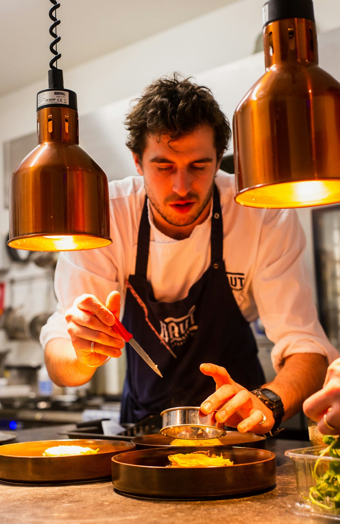 Executive chef plating a dish